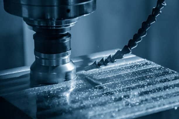 Face milling operation smoothing a metal surface with precision tooling