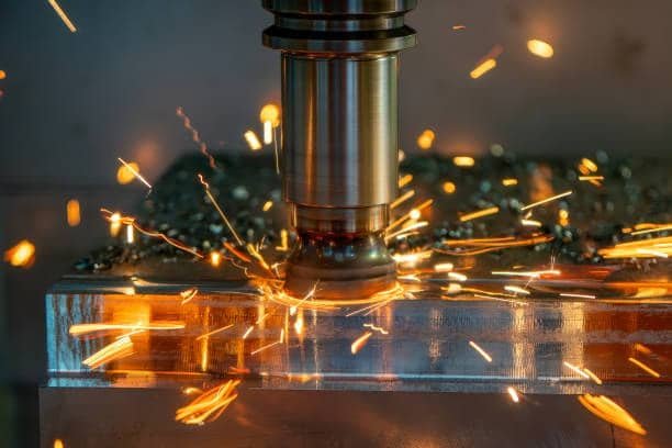 Face milling operation with sparks flying during metal surface cutting