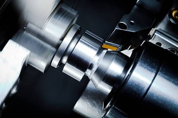 Facing operation using a lathe tool to create a flat surface at the end of a rotating workpiece