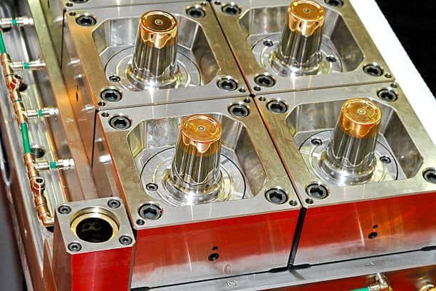 Hot runner mold showcasing four multi-cavity core pins designed for high-precision injection molding.