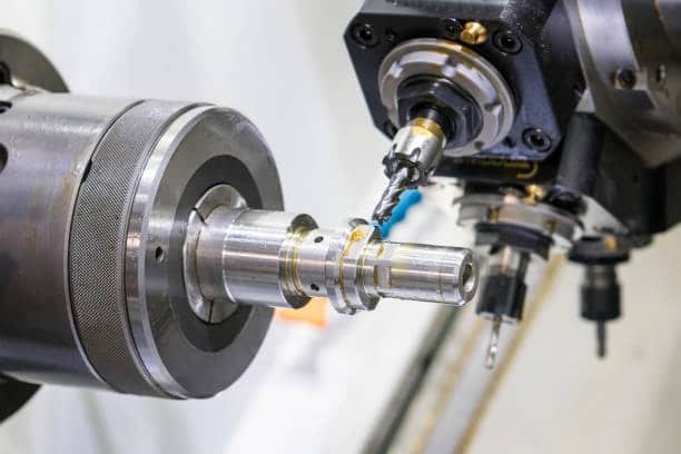 Internal turning and boring operation enlarging the inner diameter of a metal workpiece on CNC lathe