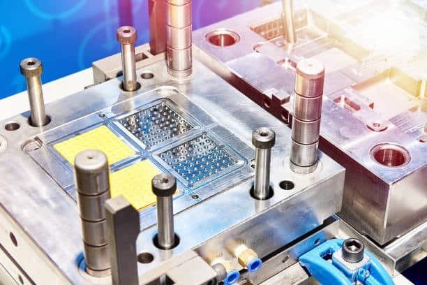 Multi-cavity hot runner injection mold plate with multiple gates and efficient runner design.