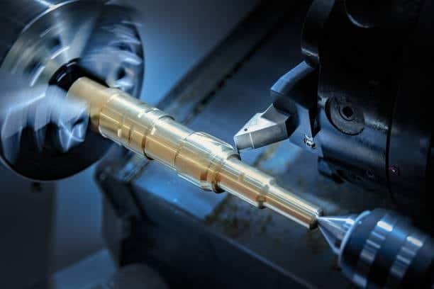 Taper turning process machining a conical shape along the length of a metal rod