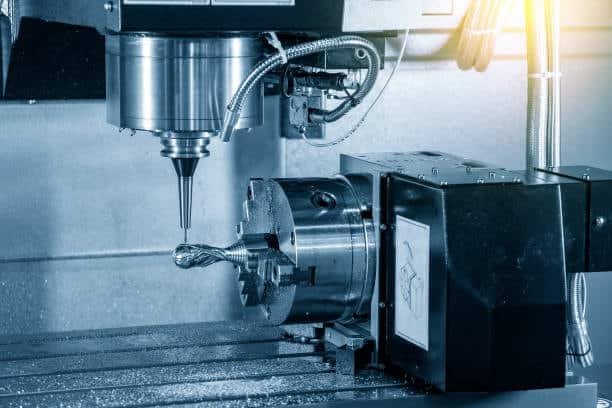 4-axis CNC milling machine operating with rotary table for simultaneous machining