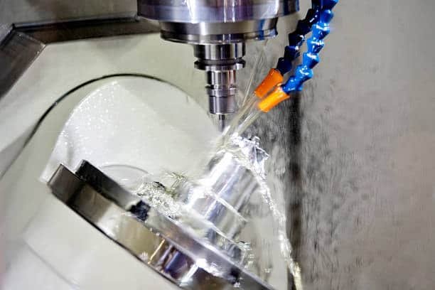 Five-axis CNC machine cutting complex surface with high-pressure coolant