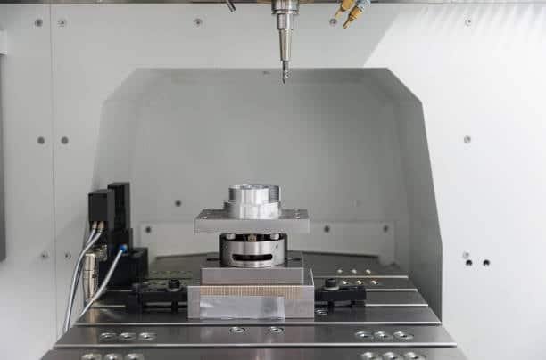 ABS plastic block mounted on CNC fixture for precision machining