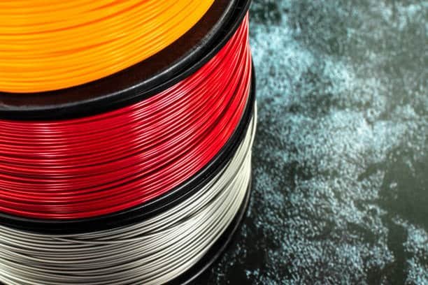Close-up of colorful PLA filaments used in injection molding processes