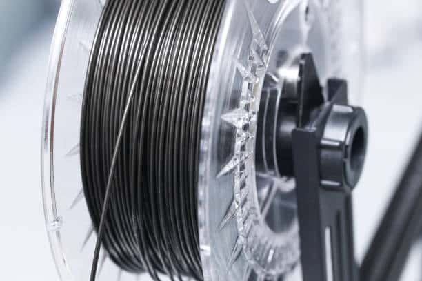 Transparent spool with black PLA filament wire for precision molding