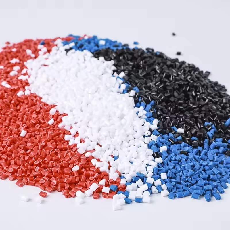 Colorful polypropylene granules in red, white, blue, and black for injection molding and packaging