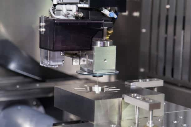 EDM electrode machining detailed cavity in metal workpiece