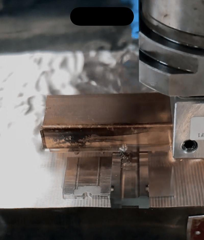 Copper electrode shaping precision cavity during EDM process with minimal mechanical force