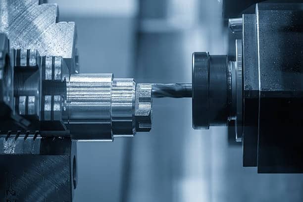 CNC machine aligning tool with metal shaft to control surface roughness