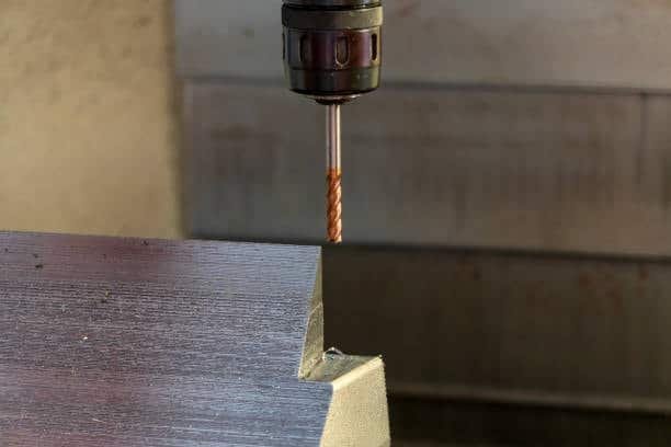 Milling tool processing sharp edge of aluminum block