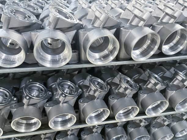 High-precision MIM metal parts with threaded ends arranged for inspection or packaging