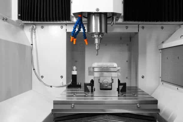 Precision 4-axis CNC machine interior view with advanced milling head