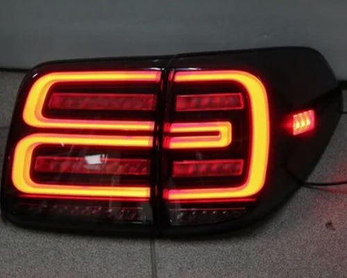 Illuminated custom LED tail light prototype produced through rapid prototyping for design validation.