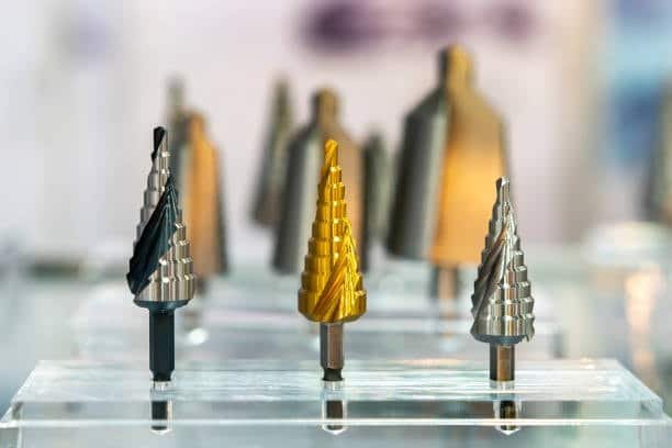Step drill bits suitable for machining titanium alloys in CNC applications