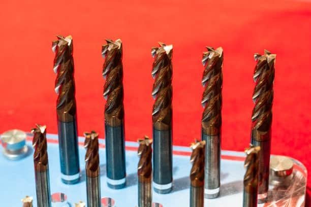 Titanium CNC end mills arranged in tool holder for industrial machining