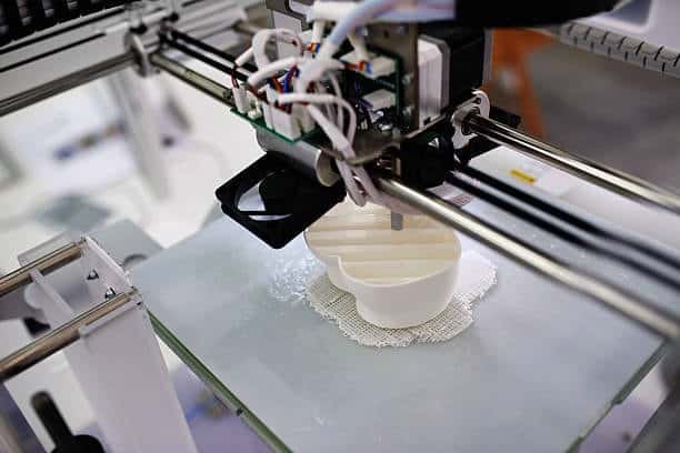FDM printer fabricating a white shell mold using support material