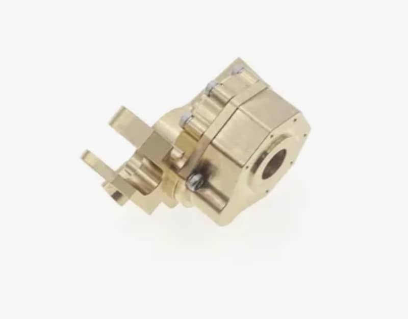 A gold-colored precision CNC-machined metal component showcasing complex geometry and fine surface finish.