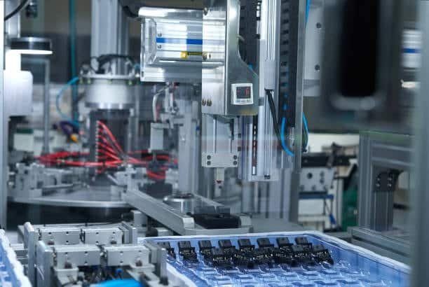 Automated injection molding machine lowering mold cost factors.