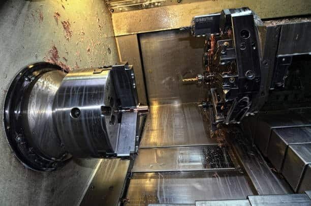 Inside view of an automated CNC turning center with multi-axis tools