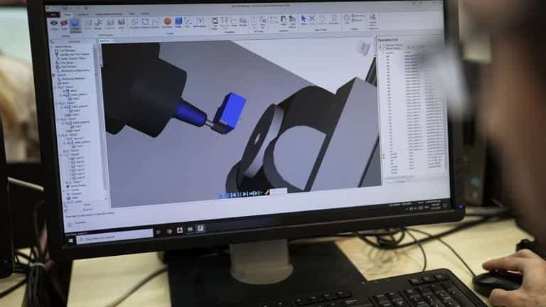 Computer-assisted design software simulating CNC machining process