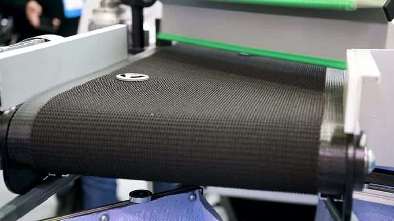 Carbon fiber woven belt in use on automated manufacturing equipment