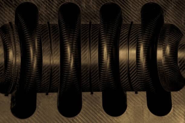 Close-up view of a carbon fiber coil structure used in high-performance mechanical systems