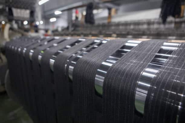 Carbon fiber tape unwinding during CNC production for aerospace or automotive components