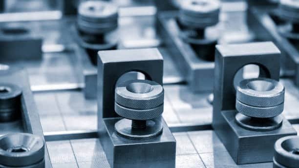 CNC fixturing blocks and clamps used to stabilize workpieces during machining