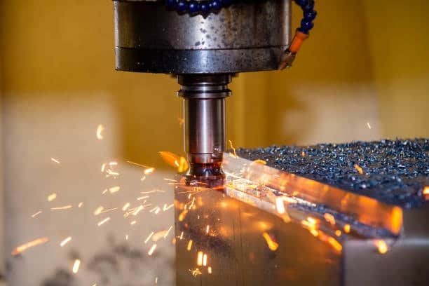 CNC milling machine generating sparks due to high cutting speed and feed rate