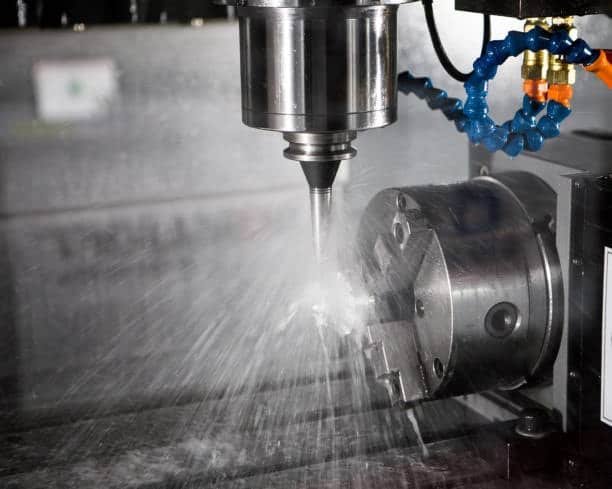 High-speed CNC milling process using coolant to prevent overheating and improve accuracy