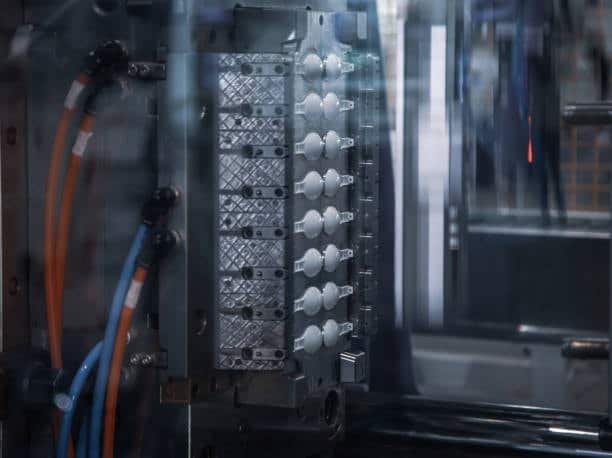 CNC machine precision machining injection molds for cost efficiency.