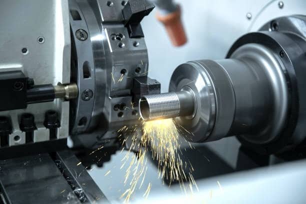 High-speed CNC screw machining with sparks during threading