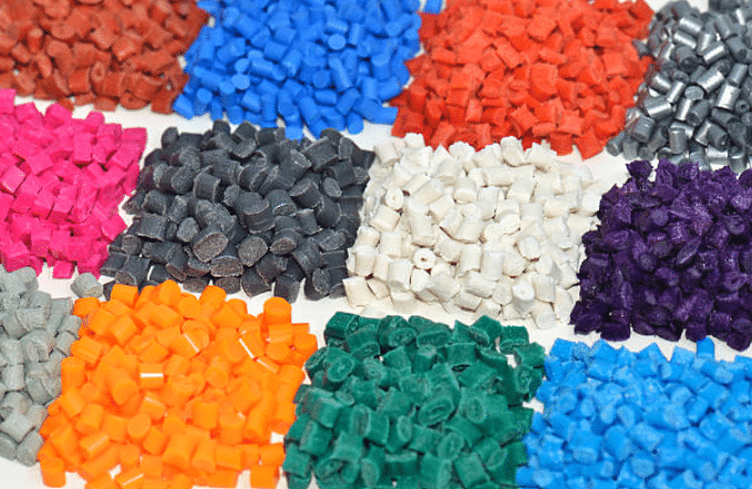 Grouped samples of ABS resin in multiple colors including black white red orange green and purple