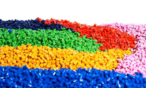 Plastic resin granules in test tubes including polyvinyl chloride (PVC) and polypropylene (PP) samples