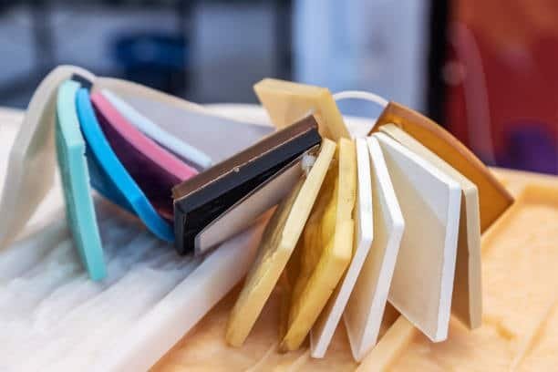 Multicolored Delrin plates representing acetal plastic versatility and processing types