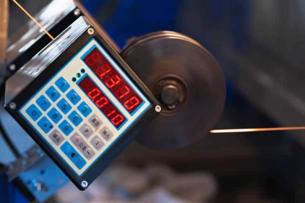 Electronic control panel displaying cutting speed and feed rate for CNC operations