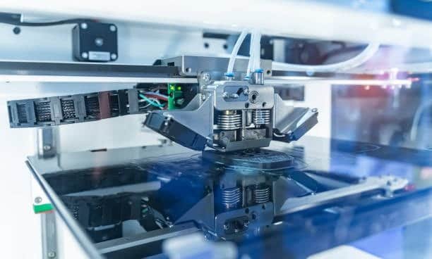 Industrial dual-extruder FDM 3D printer printing with high precision for engineering applications.