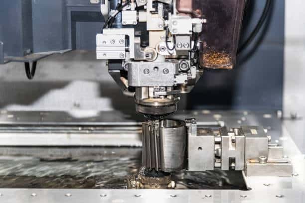 Close-up view of EDM machine working on metal component