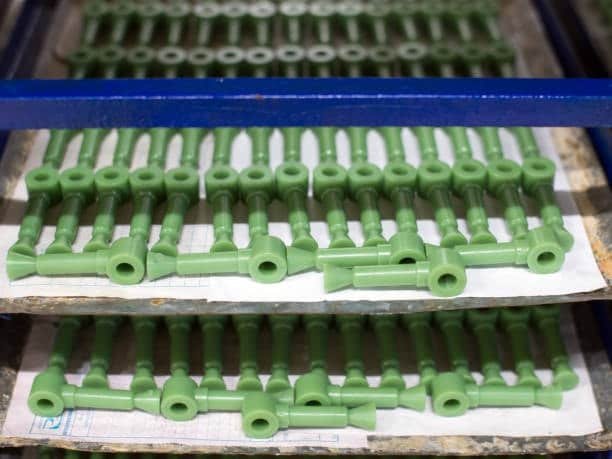 ABS or nylon injection molded parts with consistent matte surface finish on trays