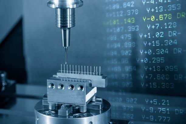 Close-up of CNC tool drilling a multi-pin connector block, showcasing real-time G-Code programming and tool control