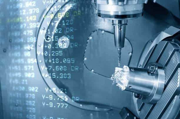 CNC spindle drilling into a precision-machined part, driven by background G-Code data for exact tool control