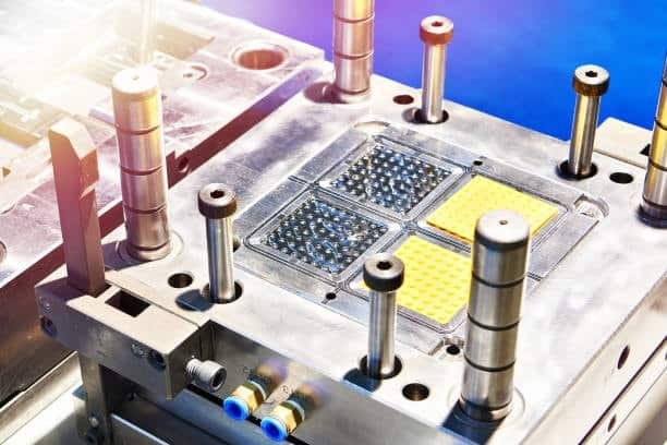 High-precision injection mold tool with detailed surface texture patterns