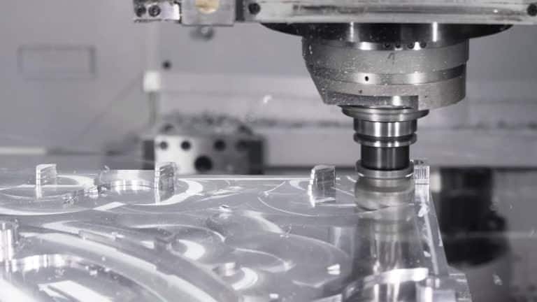 CNC machine precisely shaping aluminum workpiece