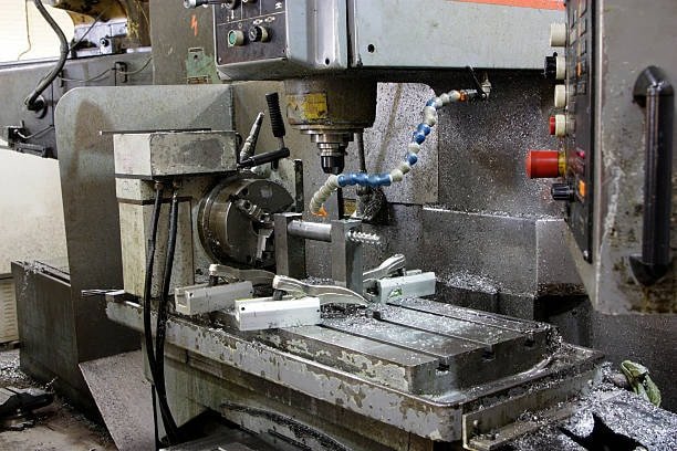 Full view of industrial CNC milling center with multiple tool setups