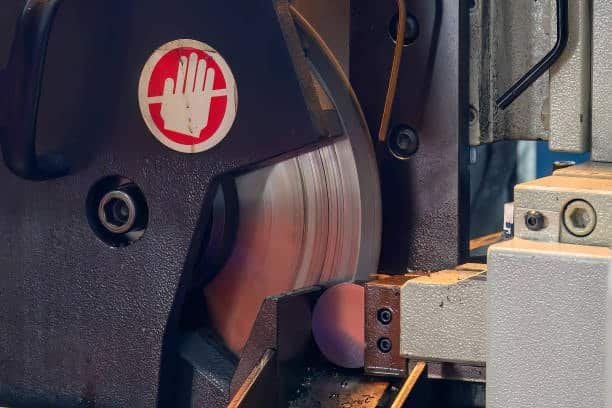 High-speed rotating cutting disc used for slicing metal in automated CNC setups