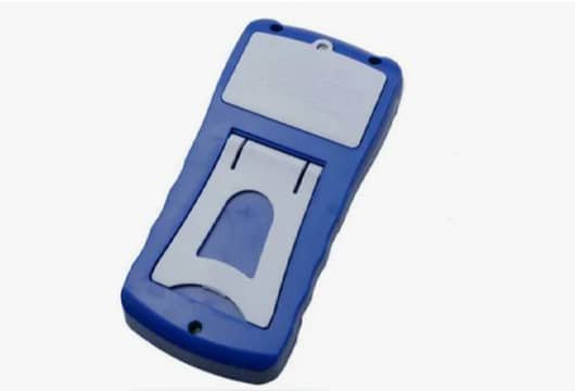 A rigid device housing featuring a blue TPE overmolded layer for ergonomic grip and enhanced functionality.