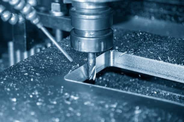 Milling cutter removing metal from steel surface